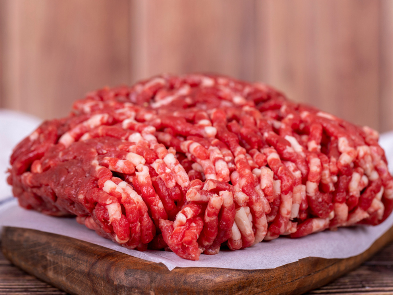 Raw mince meat on a baking sheet