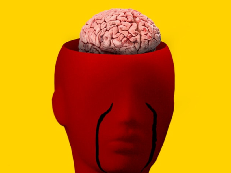 Red face with tears and exposed brain