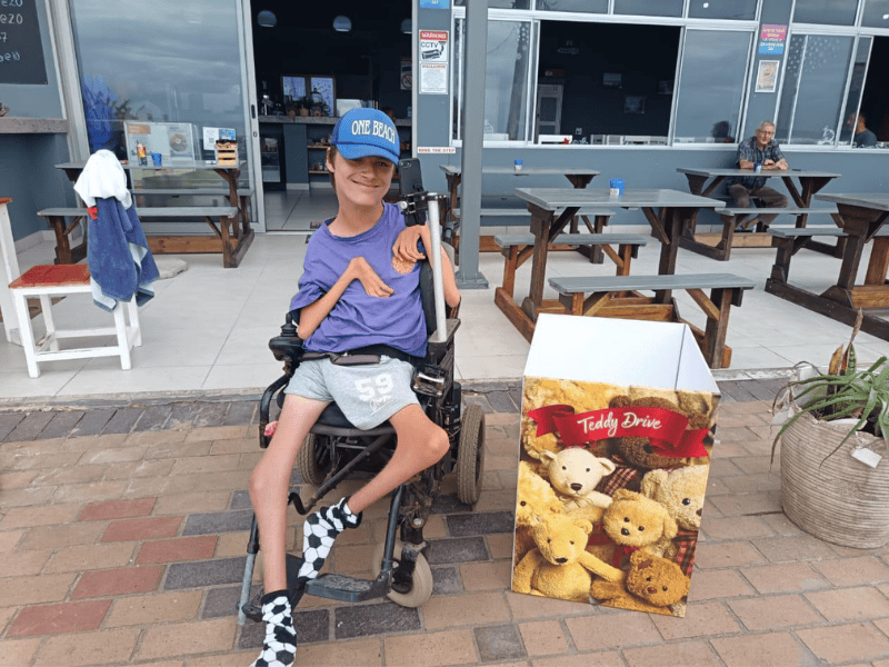 Reece Smith sitting on his wheelchair at the Amanzimtoti beach