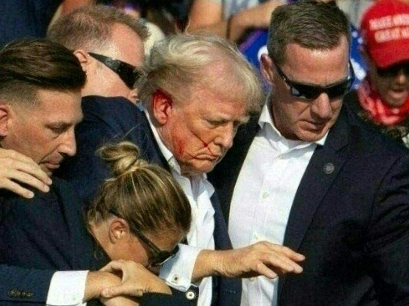 Republican candidate Donald Trump is seen with blood on his face