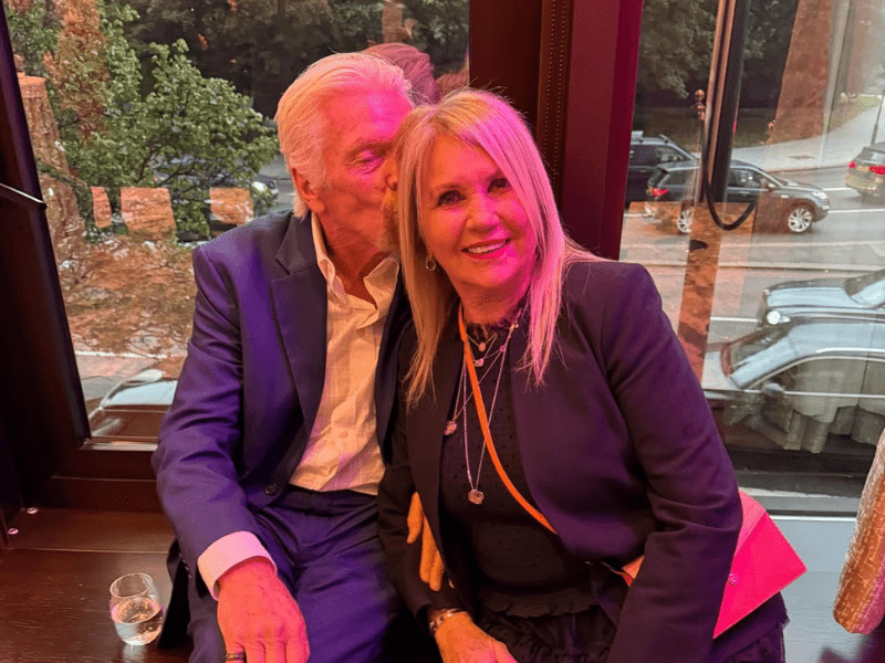 Richard Branson kisses his wife Joan on the cheek