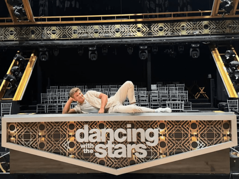 Robert Irwin poses on a stage with the words dancing with the stars