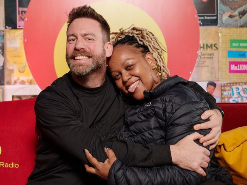 Rory Petzer hugs Carol Ofori at an event