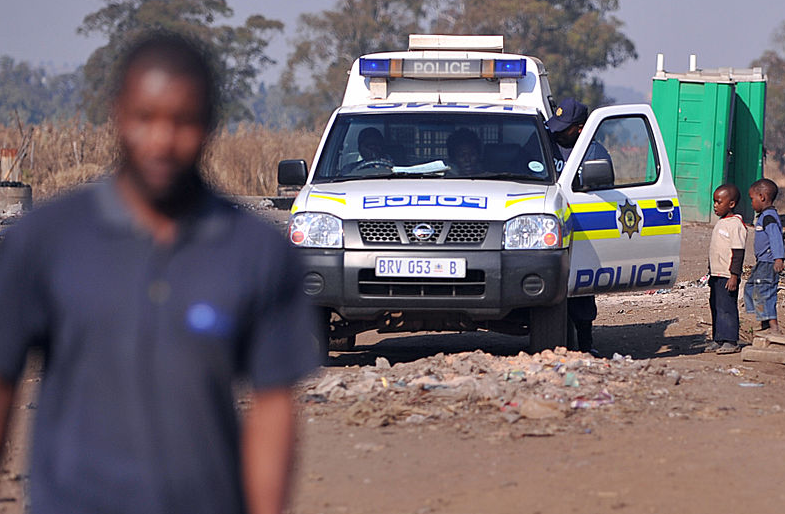 SAPS van in township.PNG