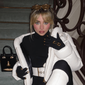Sabrina Carpenter posing on a flight of stairs