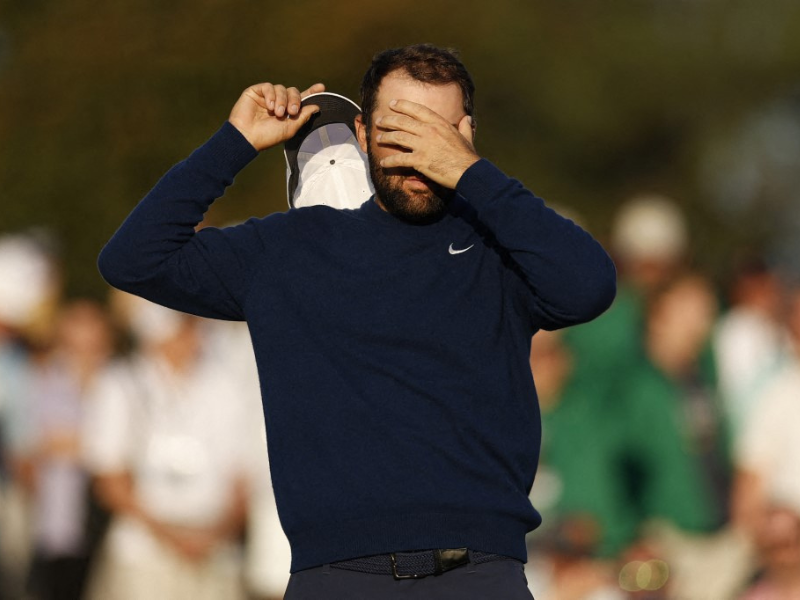 Scottie Scheffler of the United States reacts on the 18th hole during the second round of the 2025 Masters Tournament