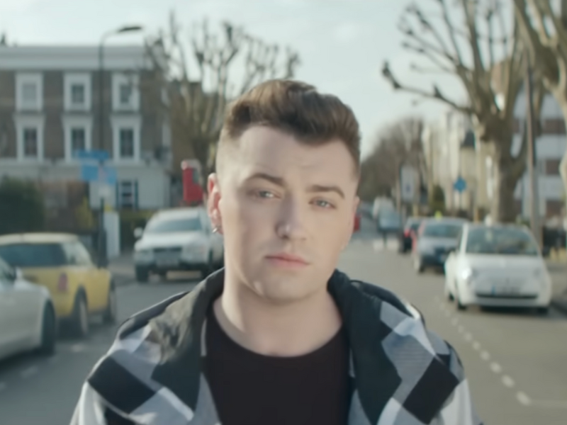 Sam Smith walking down a road