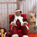 Santa Claus sitting in his village photo set up at the Pavilion