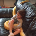 python and little girl chilling