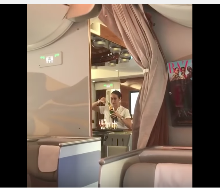 Air-hostess filmed pouring champagne back to bottle