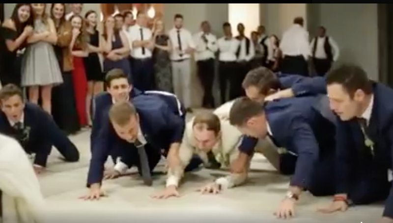 Groomsmen surprise bride with hilarious dance