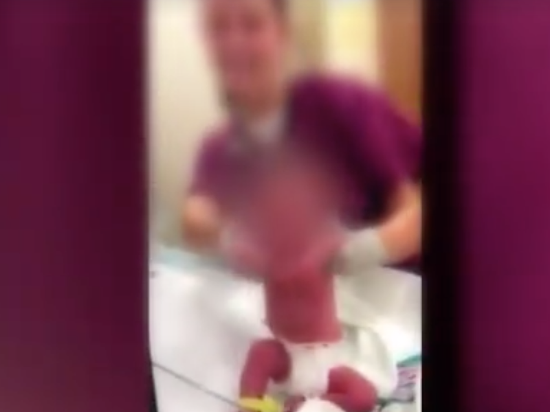 woman dancing with newborn