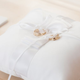 wedding rings on pillow pexels