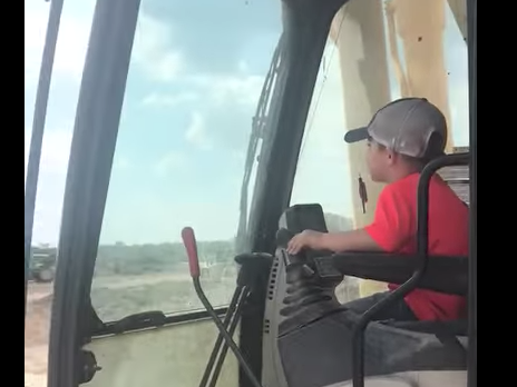 Dad lets 5-year-old son operate backhoe by himself
