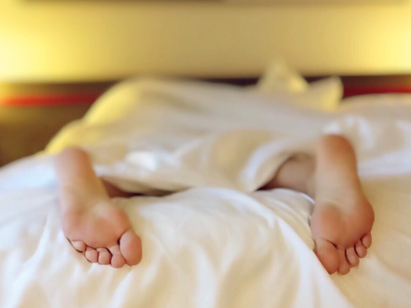 feet on bed pexels