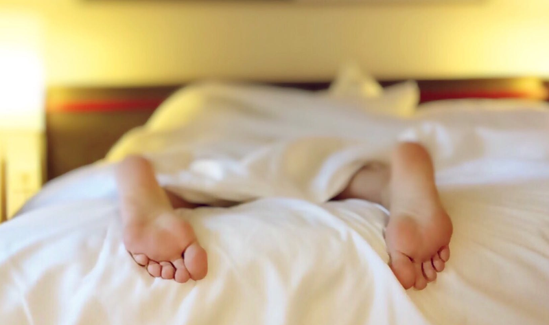 feet on bed pexels