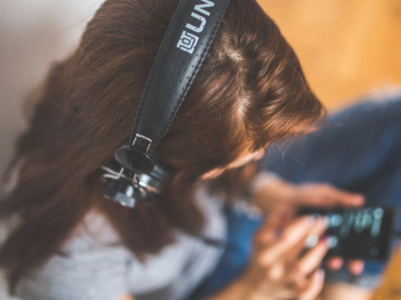 listening to music with headphones pexels