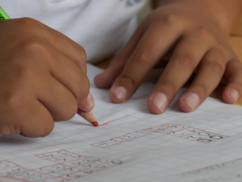 child doing homework pexels
