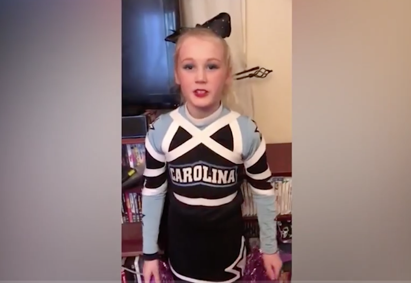 Little boy dresses as cheerleader