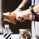 colleagues fist bumping pexels