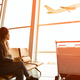 woman at airport terminal istock