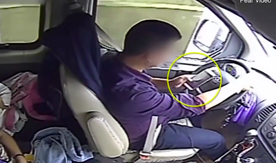 Bus driver caught on camera using phone while driving learners