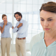 gossiping behind colleagues istock