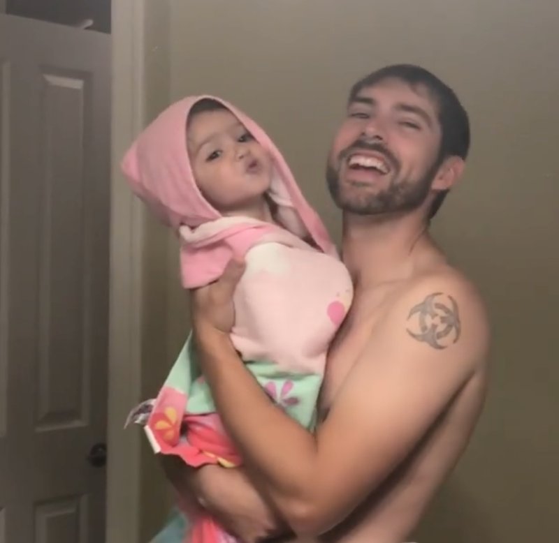 Little girl lip syncs with dad