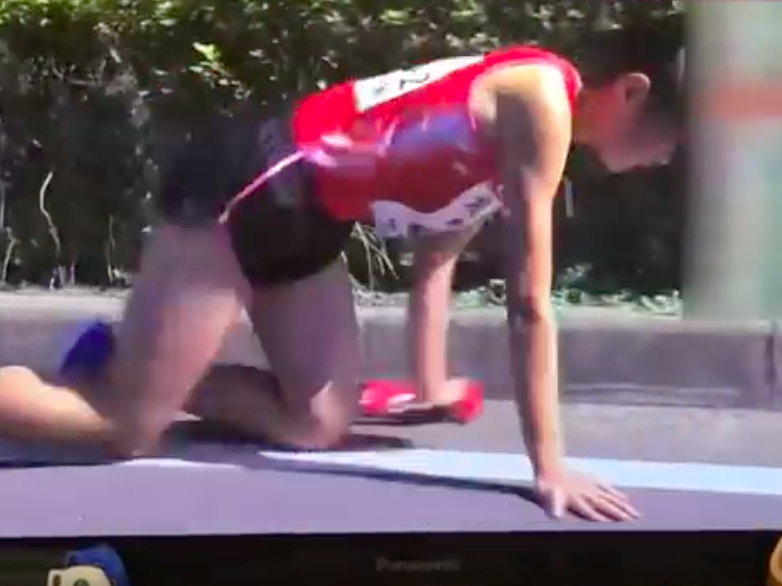 Runner crawling to finish line