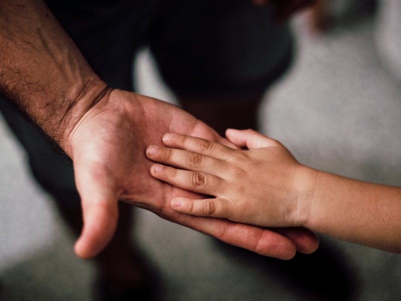 father and child hands pexels