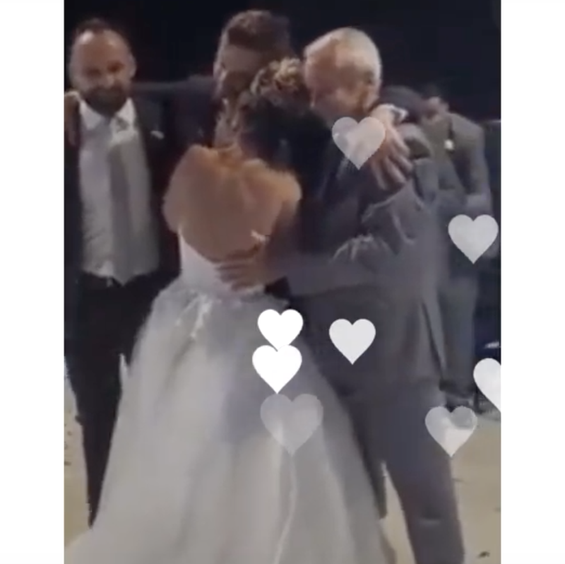 Groomsmen help groom with first dance