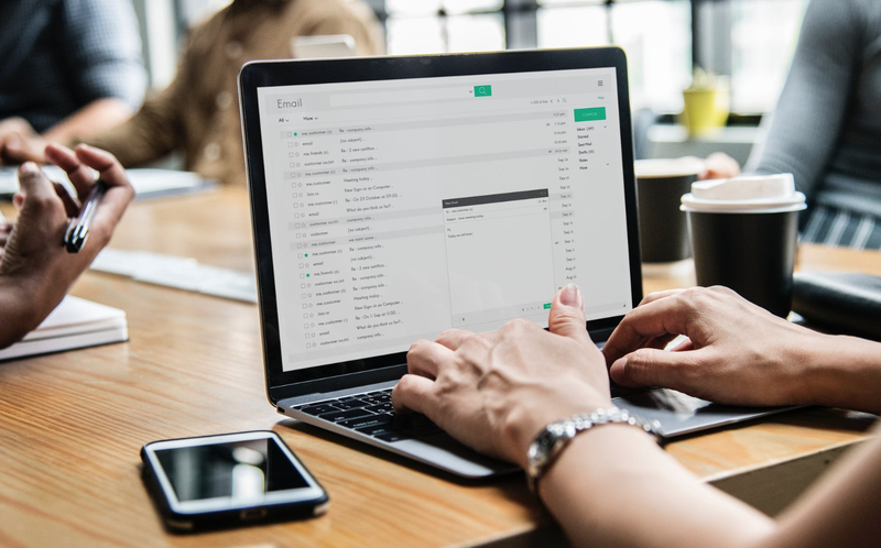 Person checking email / Pexels