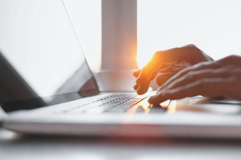 Person typing on laptop / iStock