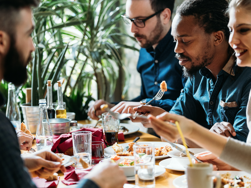 People eating at restaurant / iStock