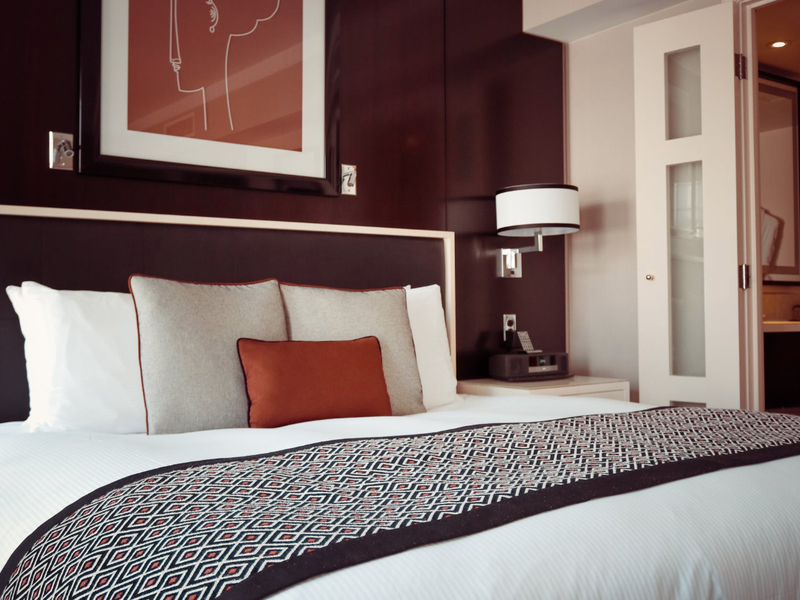 Black and Grey Bedspread on Bed and Pillow / Pexels