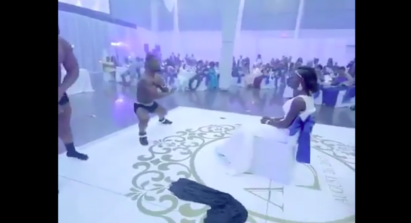 Man strips for his wife at their wedding