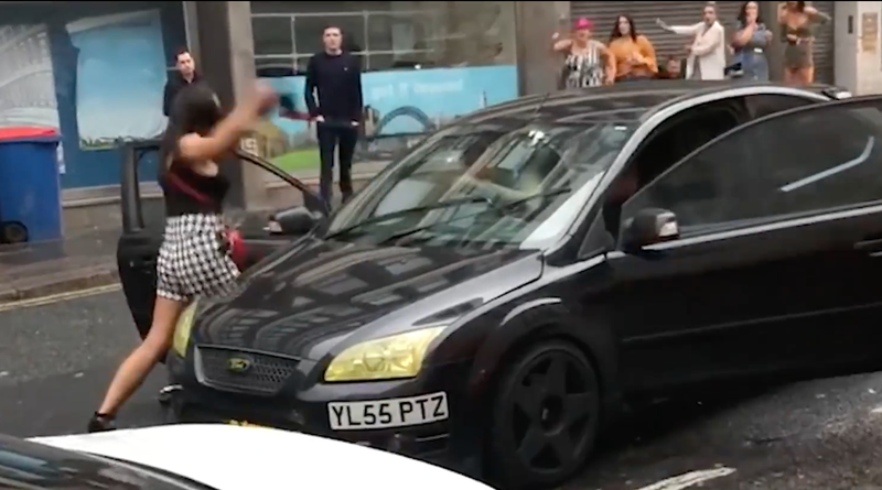 Woman hits car in road rage video