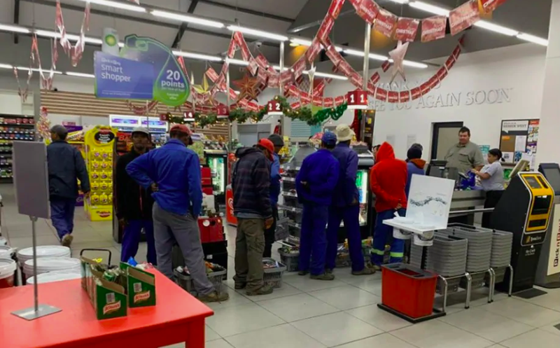 Farmer Buying Food For Workers