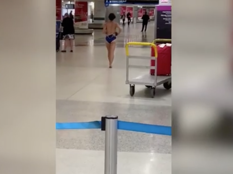 Woman strips naked at airport