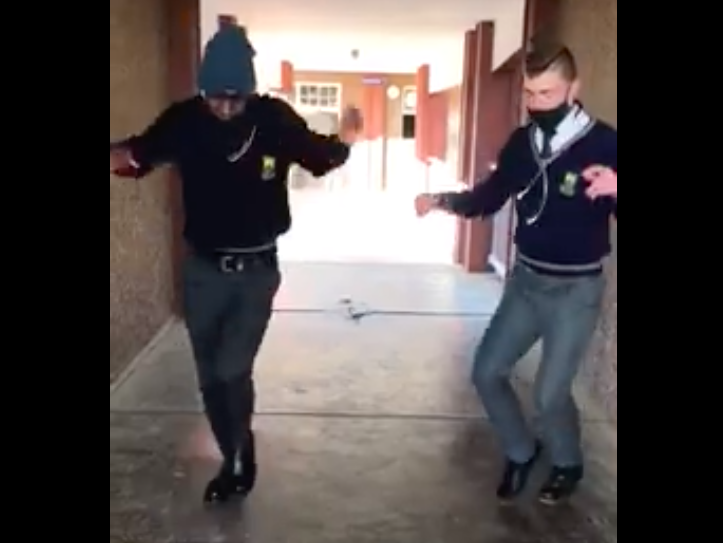School friends showing off dance moves