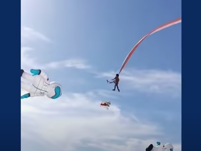 Child flies with kite