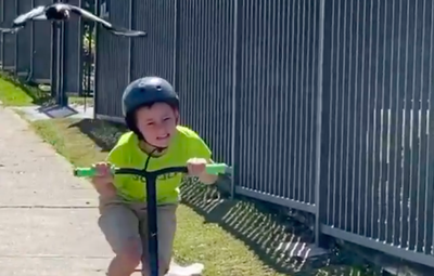 child on scooter