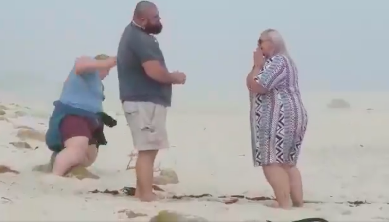 Local photographer falls while trying to capture beach proposal