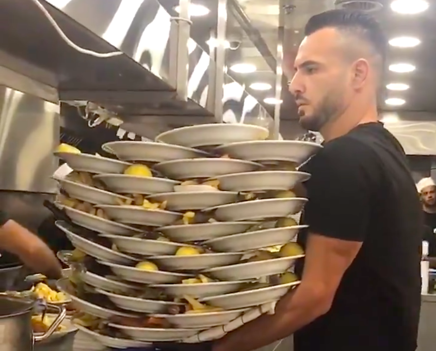 Waiter Carries Over 30 Plates At Once