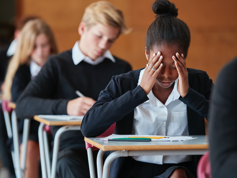 Student stressed out writing exams / iStock