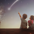 Boy and girl make a wish / iStock