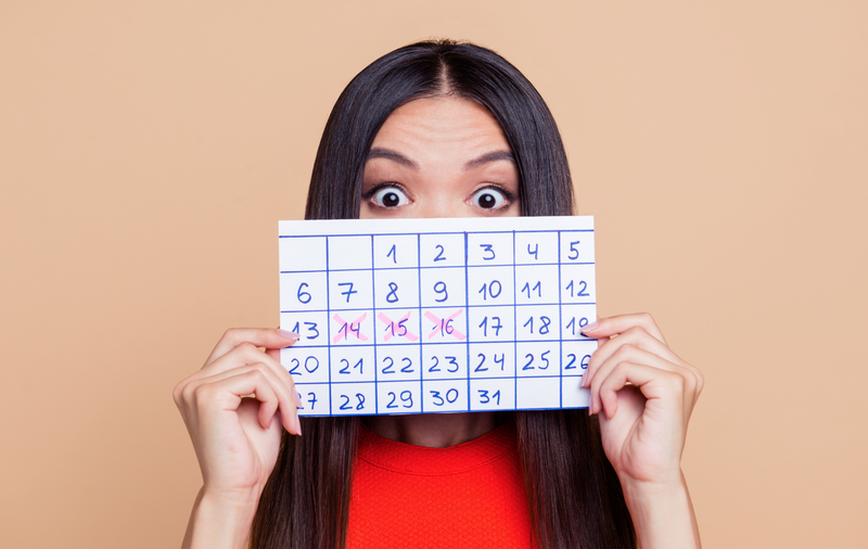 Woman with countdown calendar / iStock