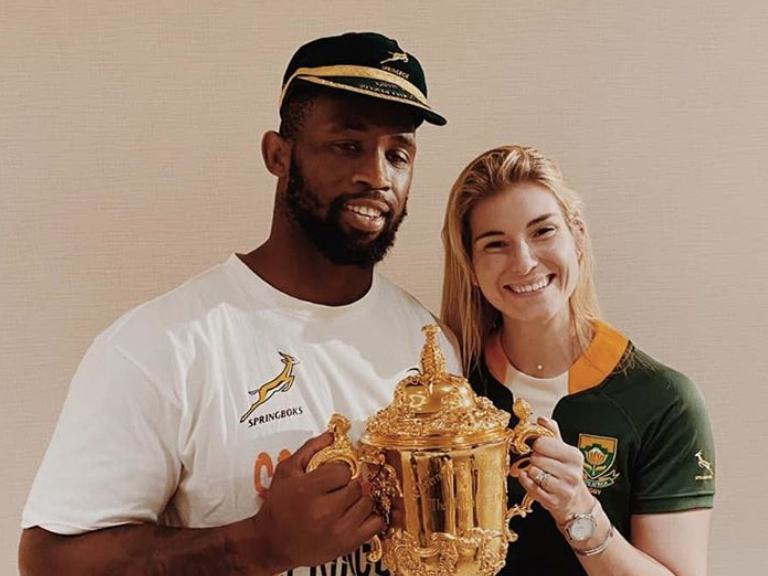 Rachel and Siya Kolisi holding the Webb Ellis Cup / Instagram