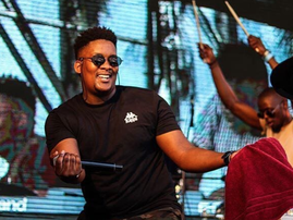 J Sbu wearing shades on stage / Instagram
