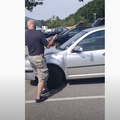 Man smashes car window
